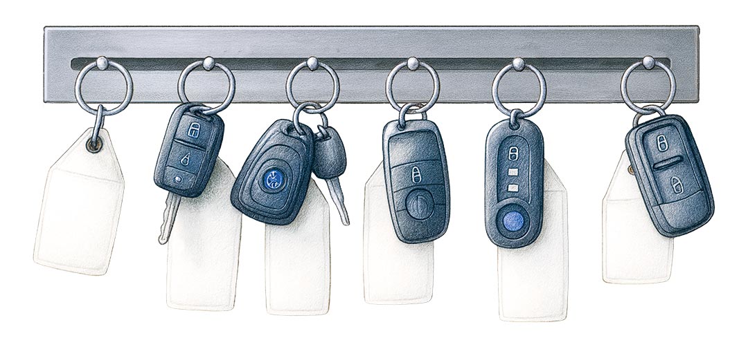 Diverse Autoschlüssel an einem Schlüsselbrett